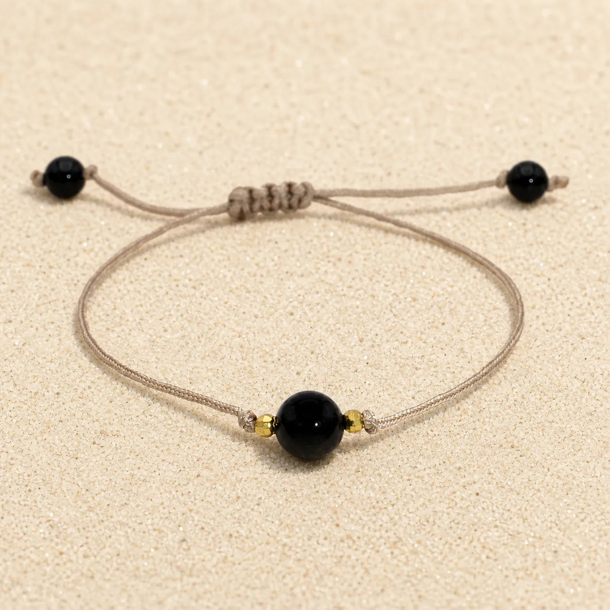 agate bracelet on light sand