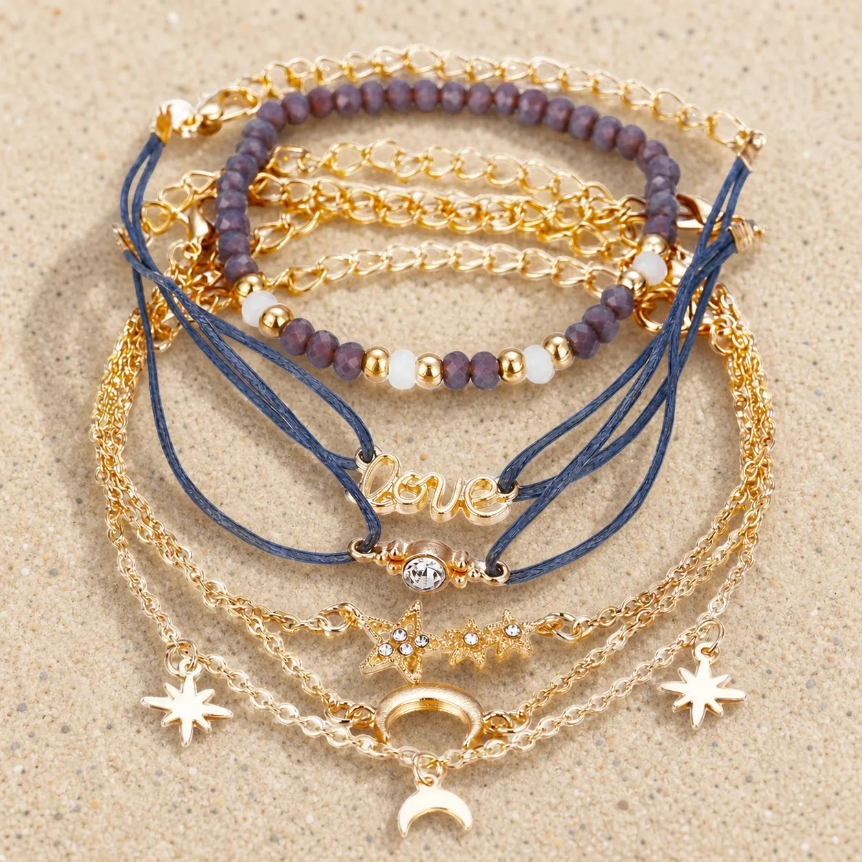 Boho Armband Set Grau Gold 6-teilig on light sand