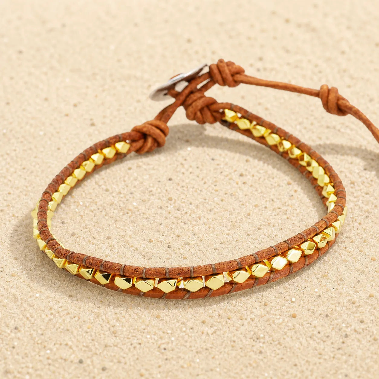 Filigree boho leather bracelet on light sand