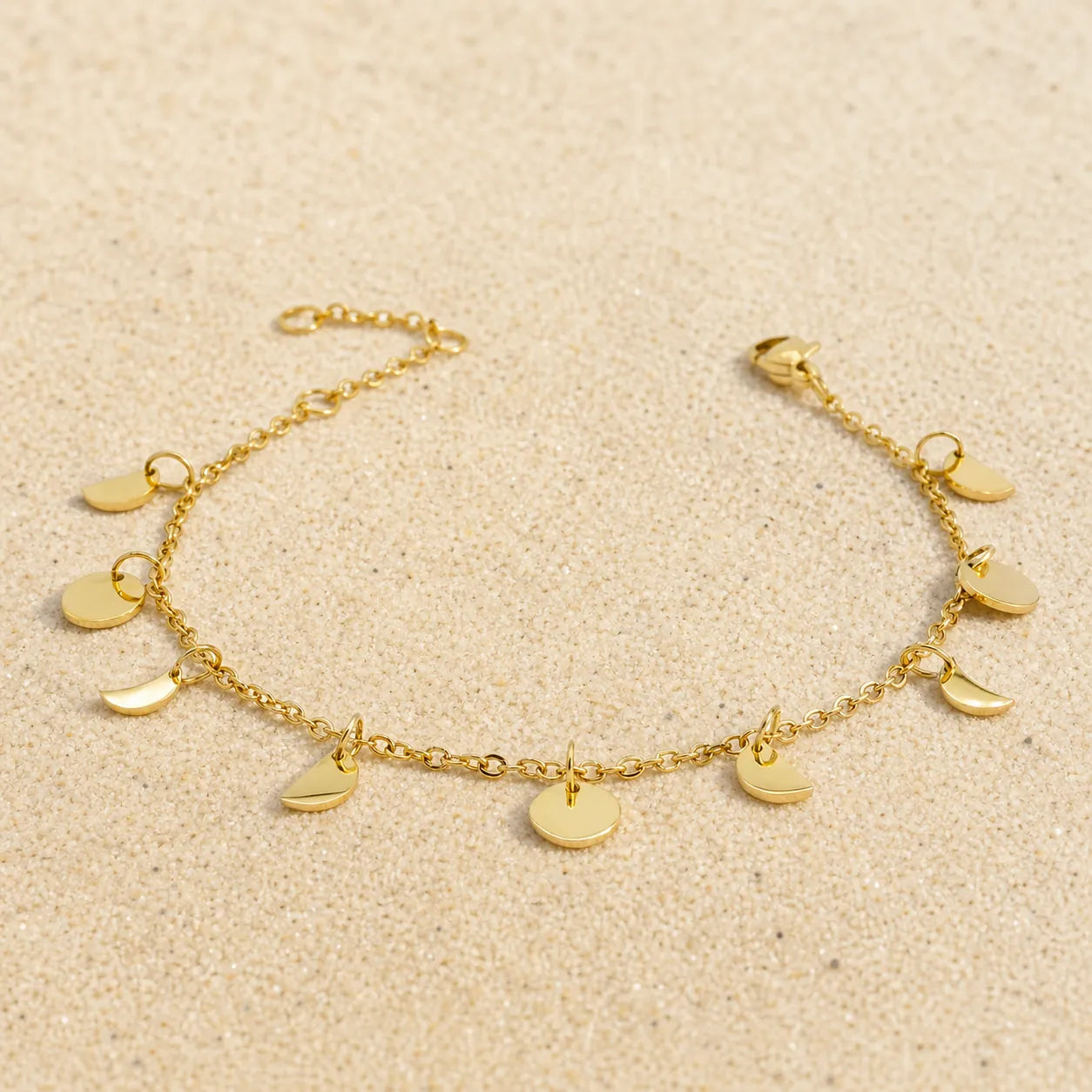 moon bracelet on light sand