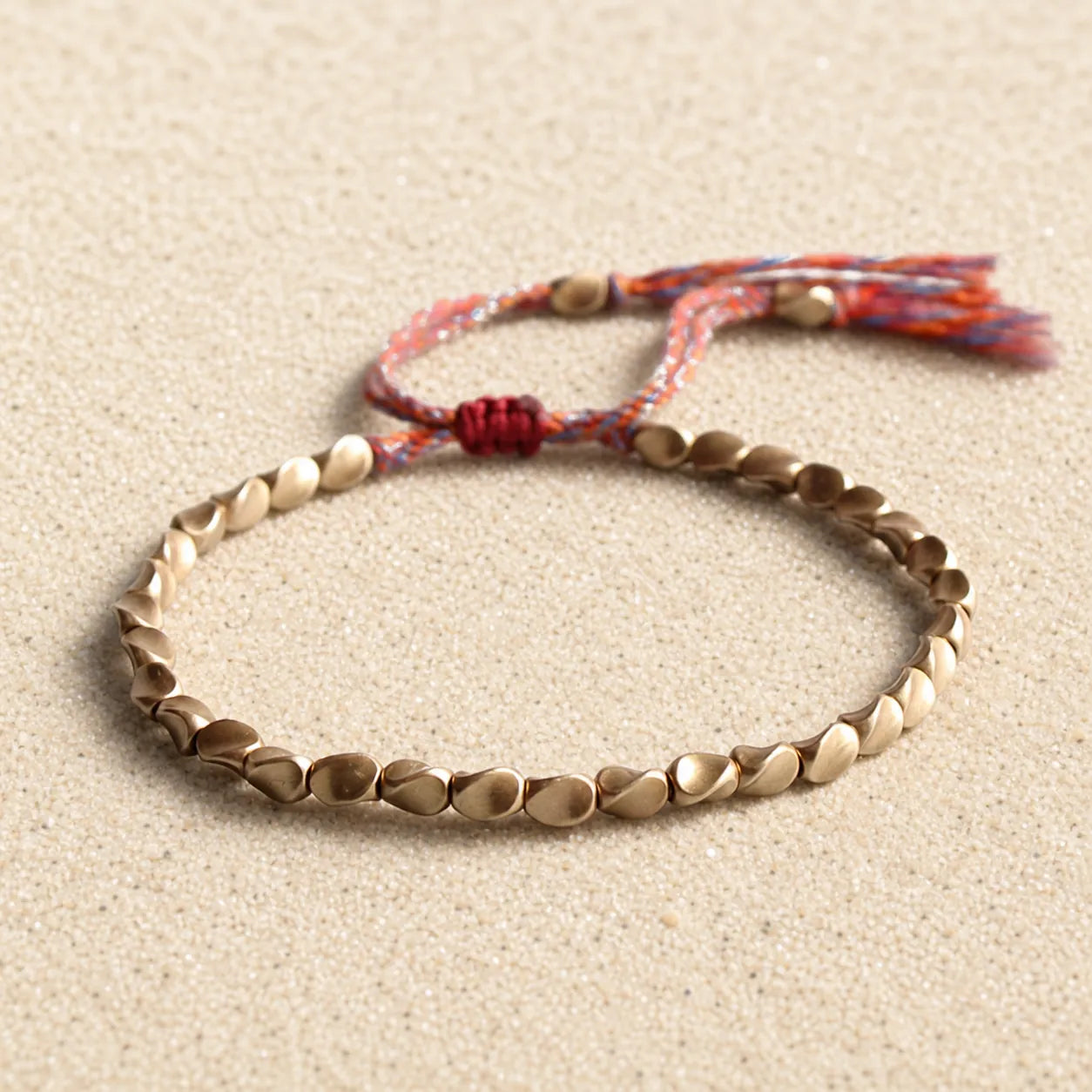 Tibetan lucky bracelet on light sand