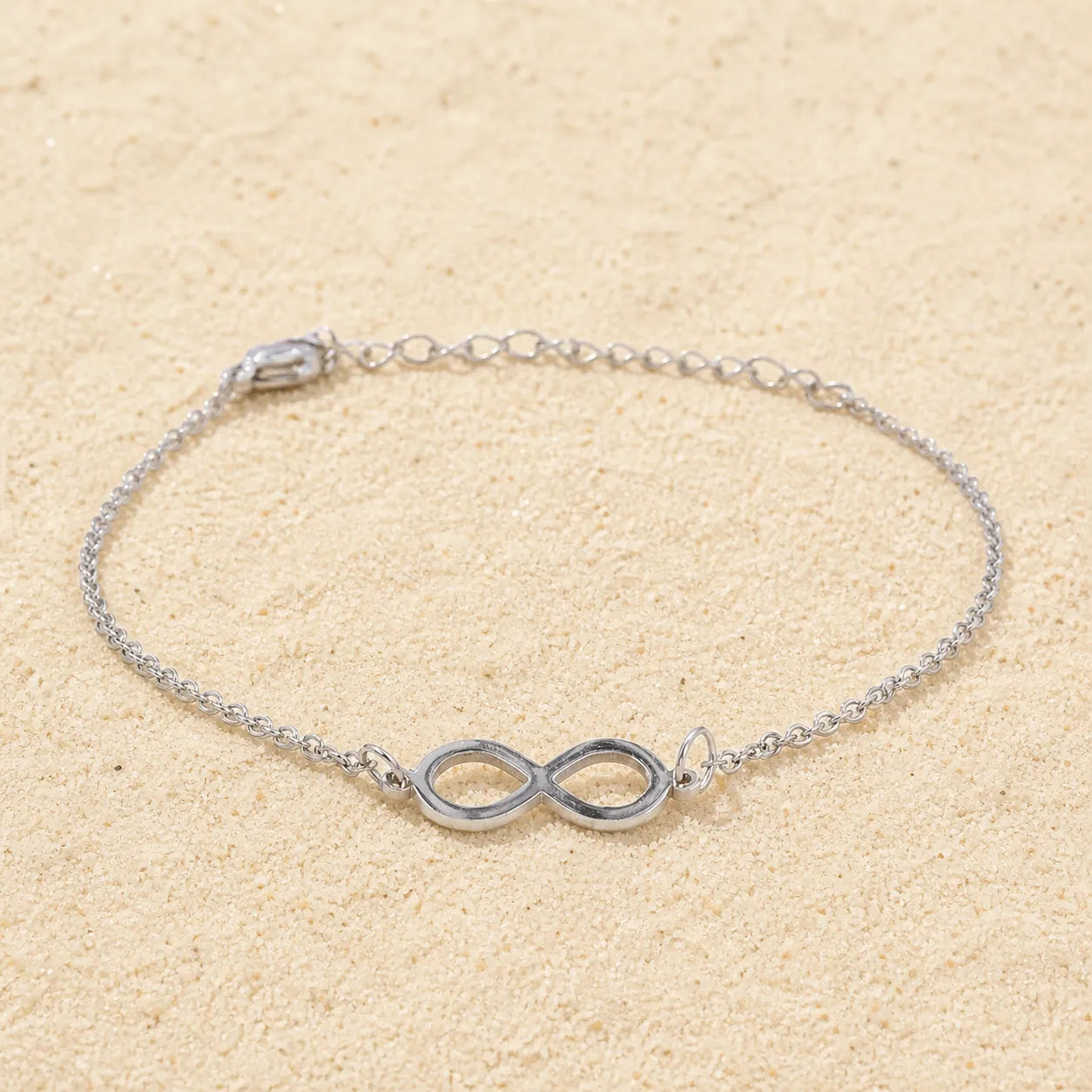 Infinity Sign Bracelet Silver on light sand