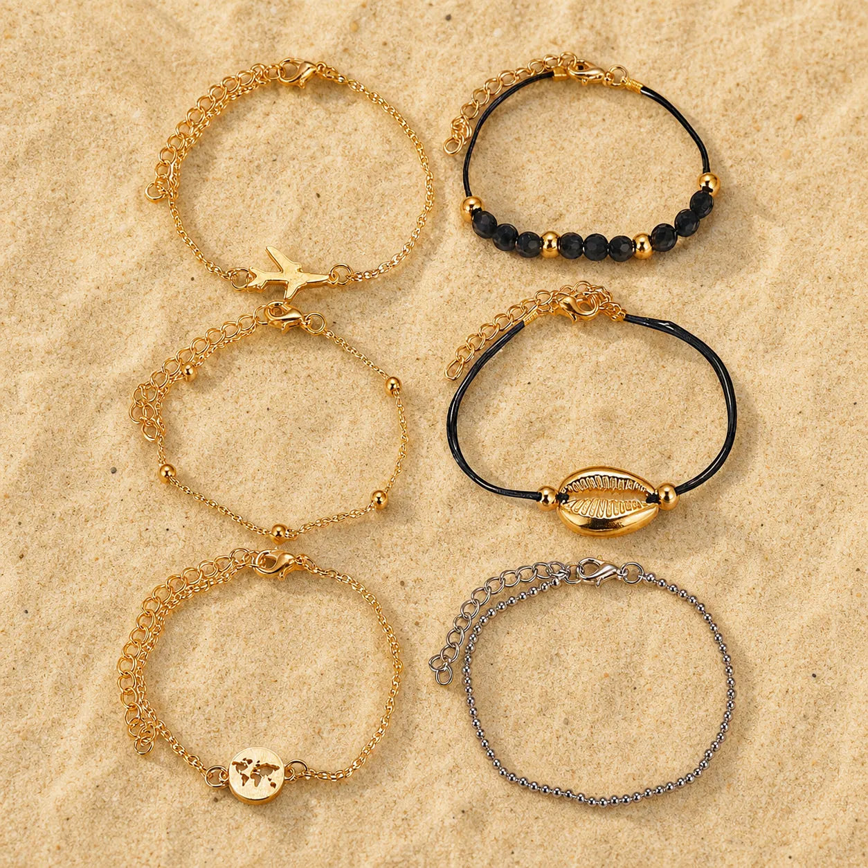 Boho Armband Set Schwarz Gold 6-teilig on light sand