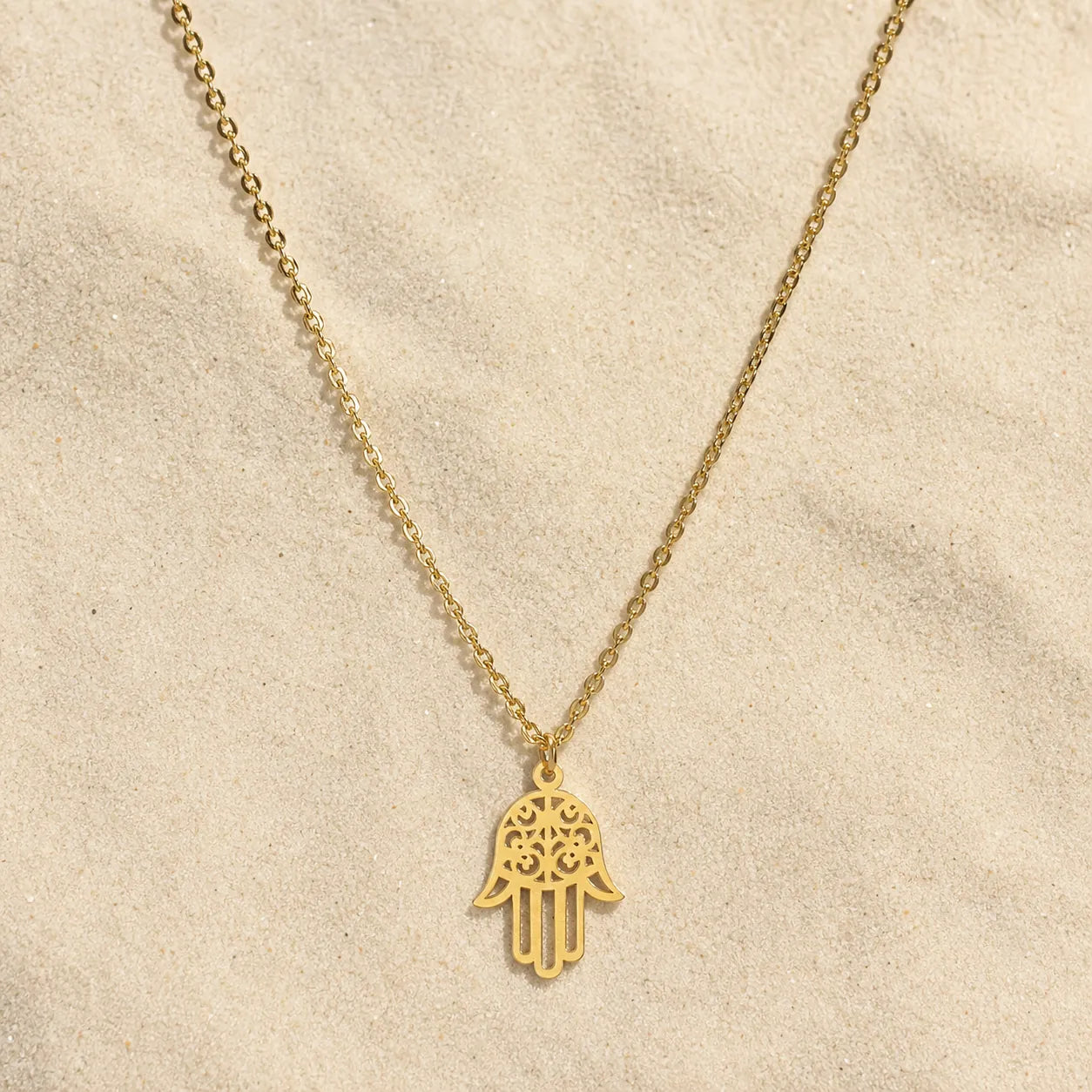 Fatima's Hand Necklace Gold on light sand