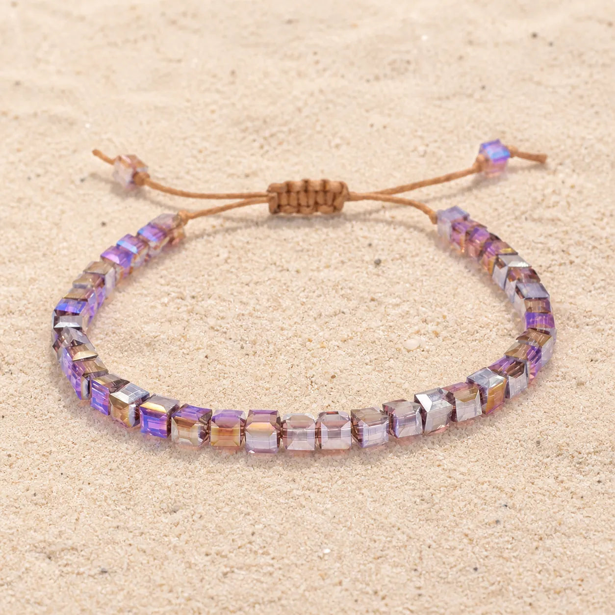 glass bracelet on light sand