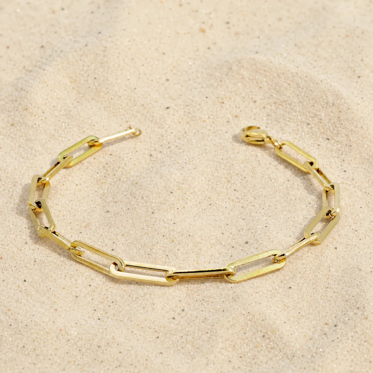 link bracelet on light sand