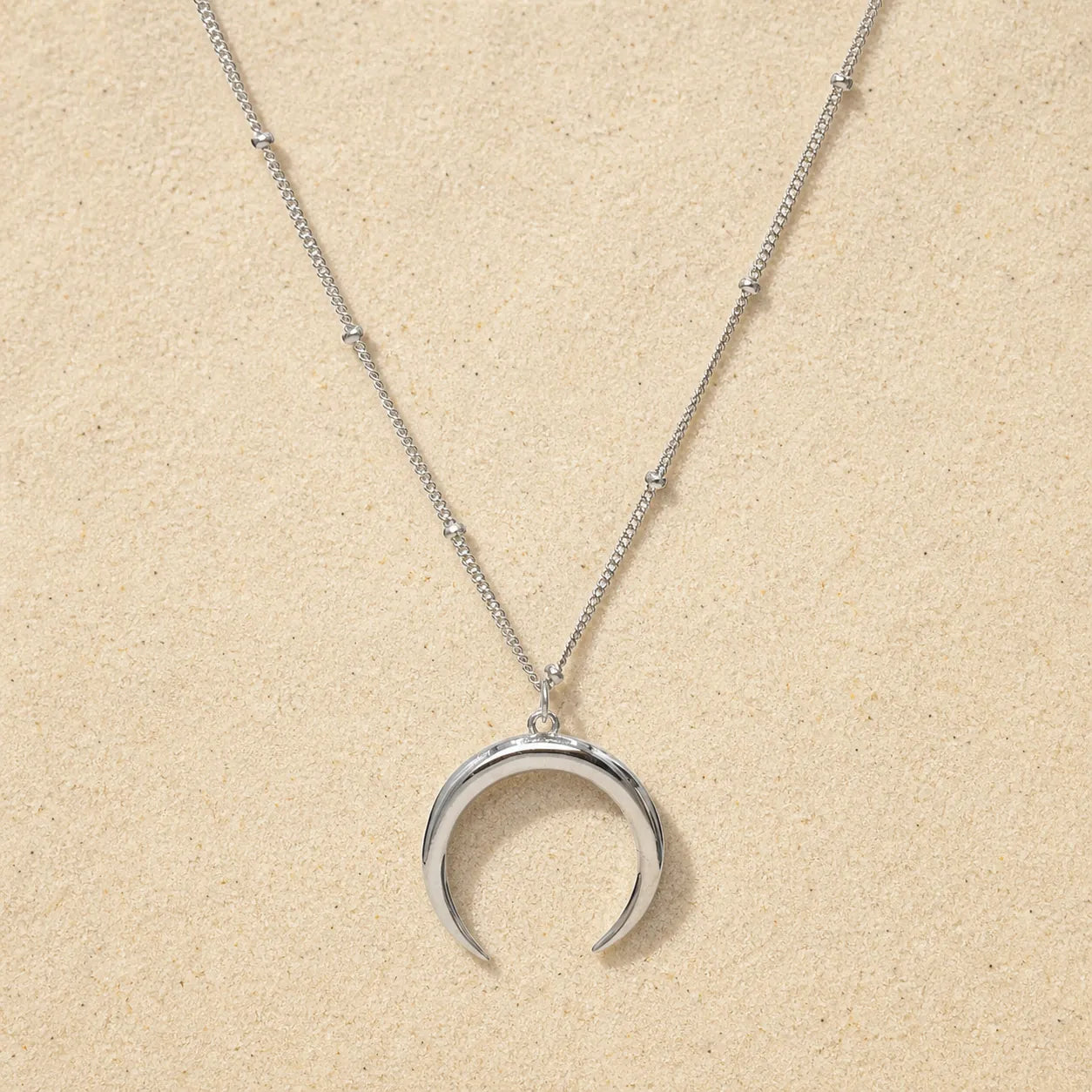 Crescent Necklace Silver on light sand