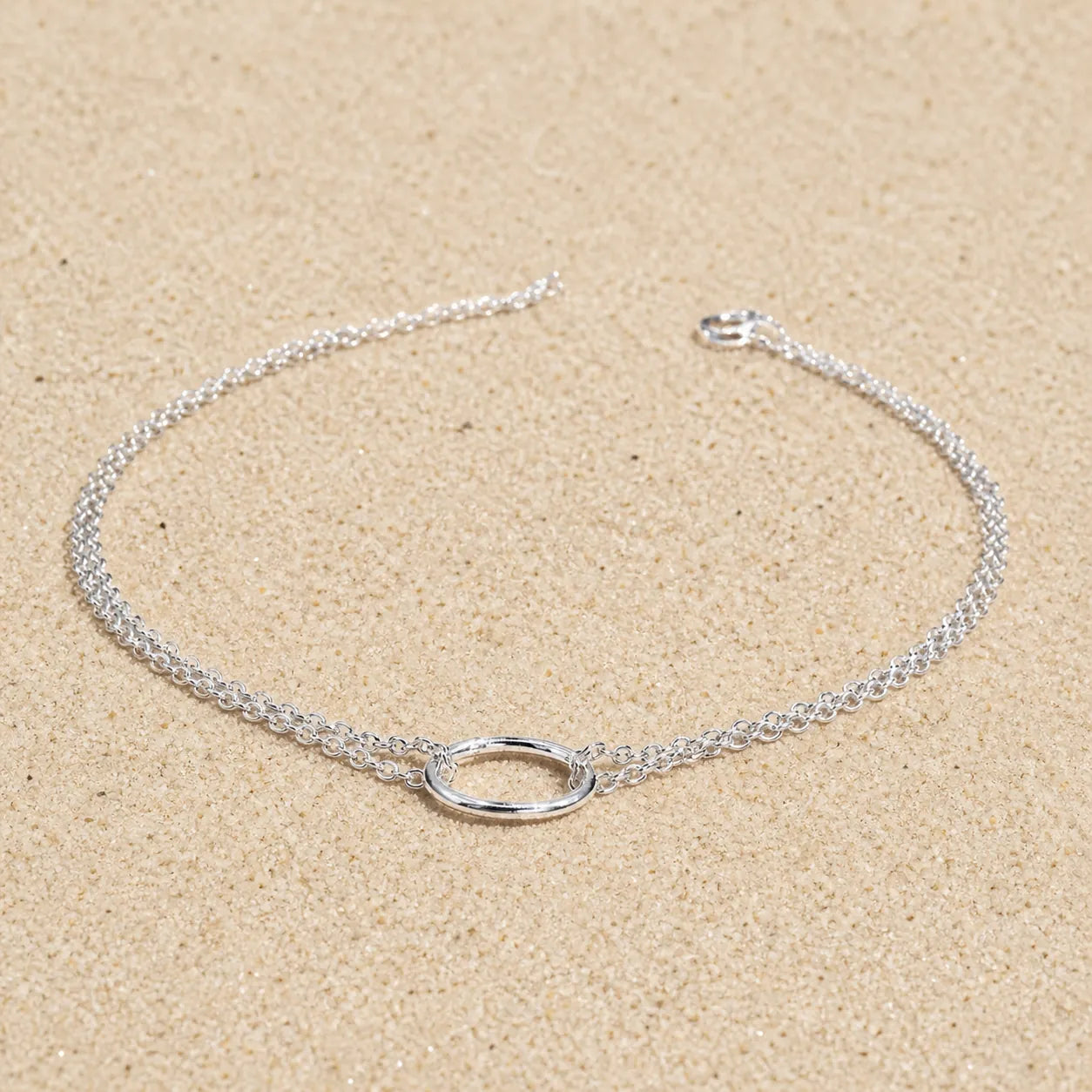 ring bracelet on light sand