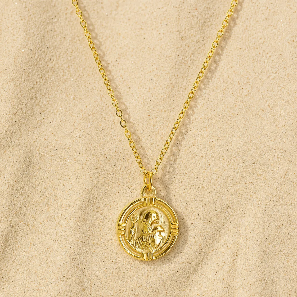 Saint Benedict Necklace Gold on light sand