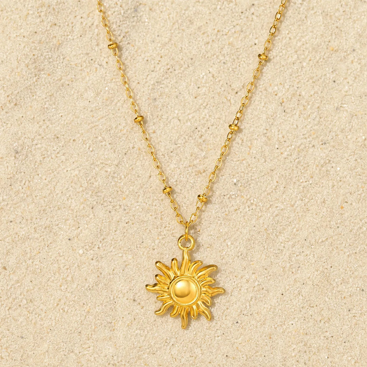 Crescent Necklace Gold on light sand